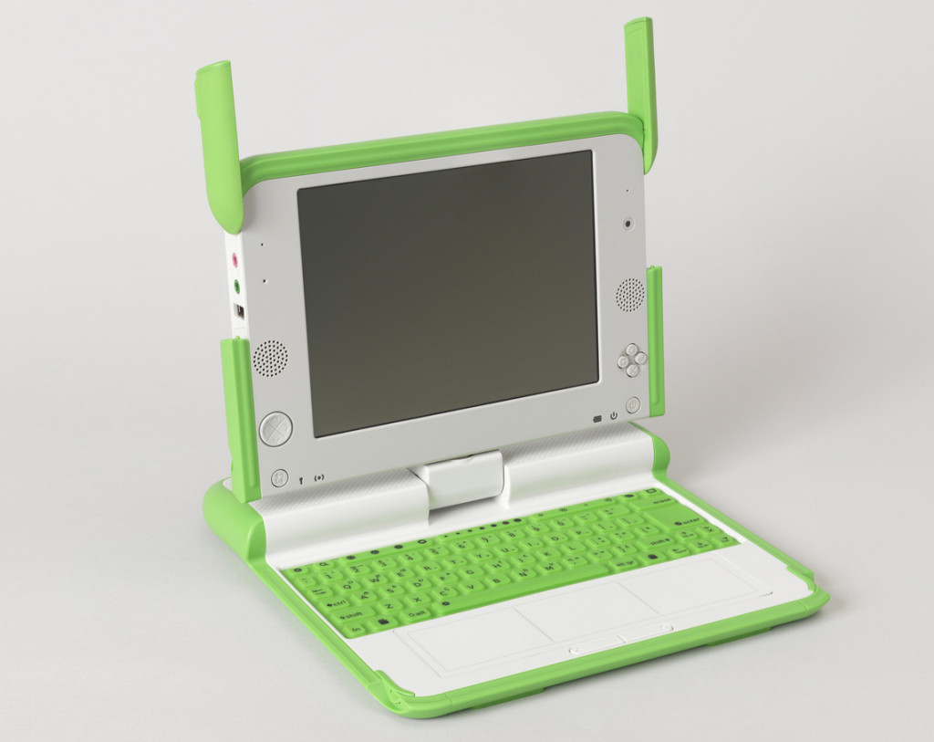 One Laptop Per Child XO Computer, 2007; Designed by Yves Béhar, Bret Recor and fuseproject; injection molded abs plastic and polycarbonate, printed rubber, liquid crystal display, electronic components; steel, copper wire (power plug); H x W x D (closed): 3.5 × 22.9 × 24.1 cm (1 3/8 in. × 9 in. × 9 1/2 in.); Gift of George R. Kravis II; 2015-5-8-a,b; Object Record